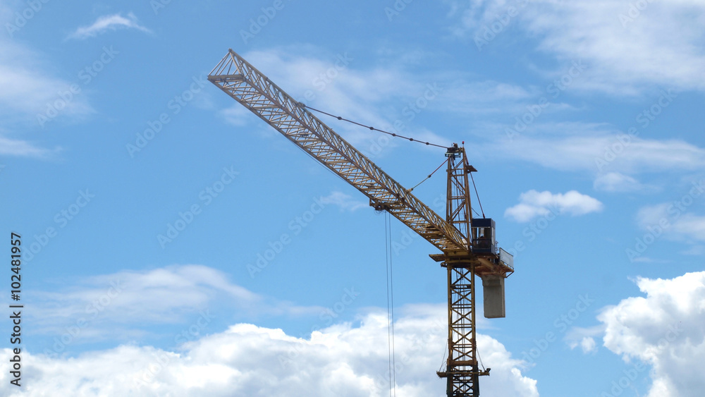Industrial landscape with cranes on the blue sky Industrial landscape with cranes on the blue sky