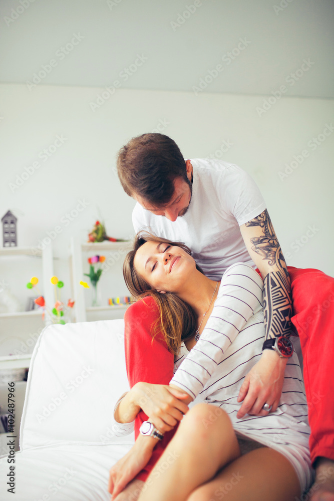 Beautiful man and woman in a white interior Beautiful man and woman in a white interior