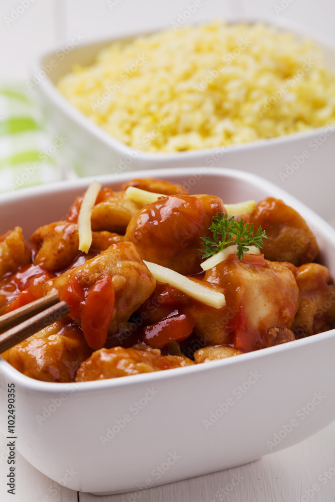 Fried chicken pieces in batter with sweet and sour sauce Fried chicken pieces in batter with sweet and sour sauce