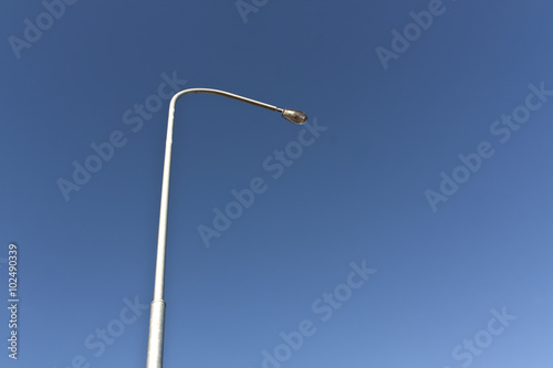 Lamp post and blue sky.