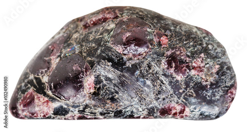 pebble with tumbled garnet gemstones in rock