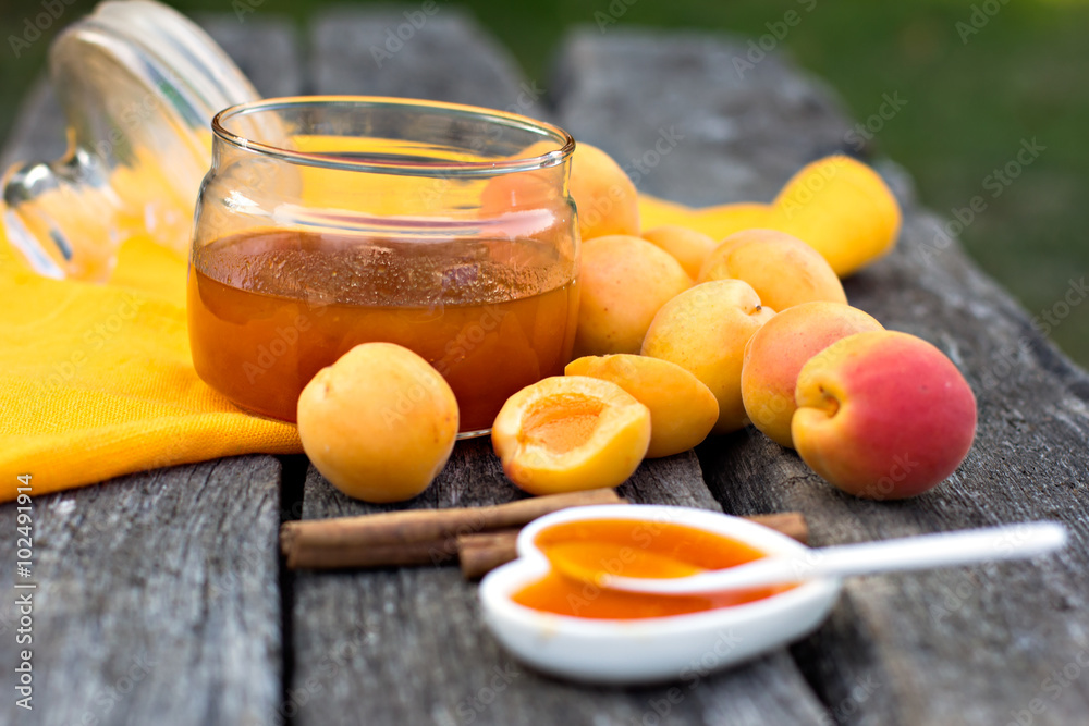 Apricot jam on rustic wooden background Apricot jam on rustic wooden background