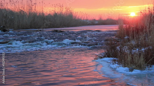 Dawn over Rushing winter river