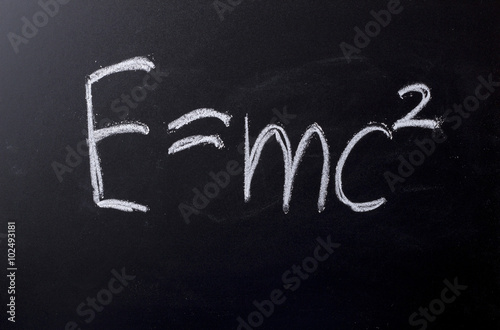 E equals mc squared on chalkboard