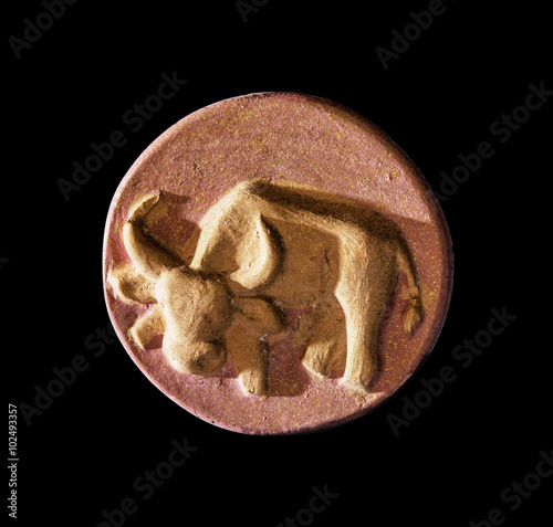 Circular taurus symbol on the dark background, zodiac sign photo