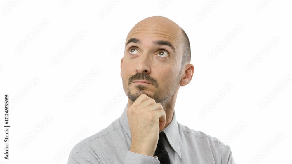 Young adult man watches something above him and thinks. Young adult man watches something above him and thinks.