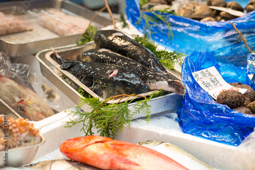 Seafood, Raw sward fish on ice selling in fresh seafood market at Kuromon, Osaka, Japan