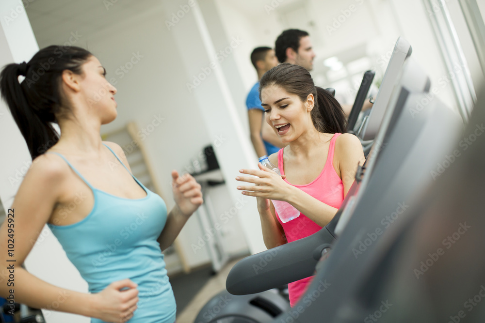 Young people training in the gym Young people training in the gym