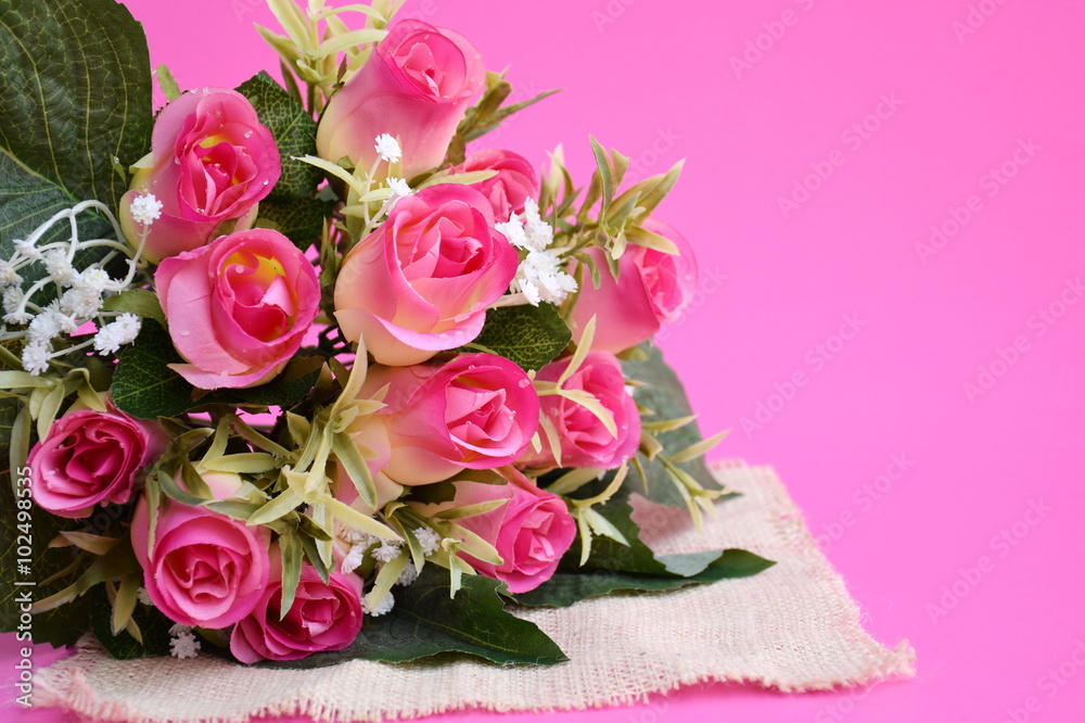 Close-up artificial pink roses.
