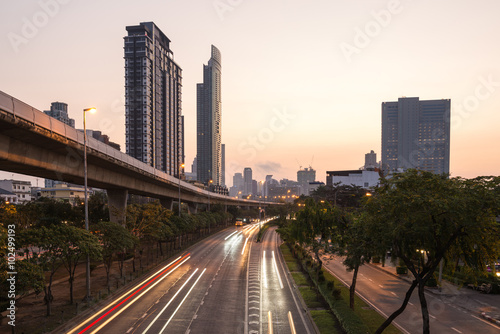 bangkok cityspace and speed train at sunrise