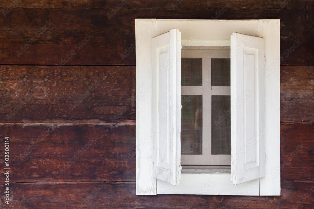 White window on wooden house 