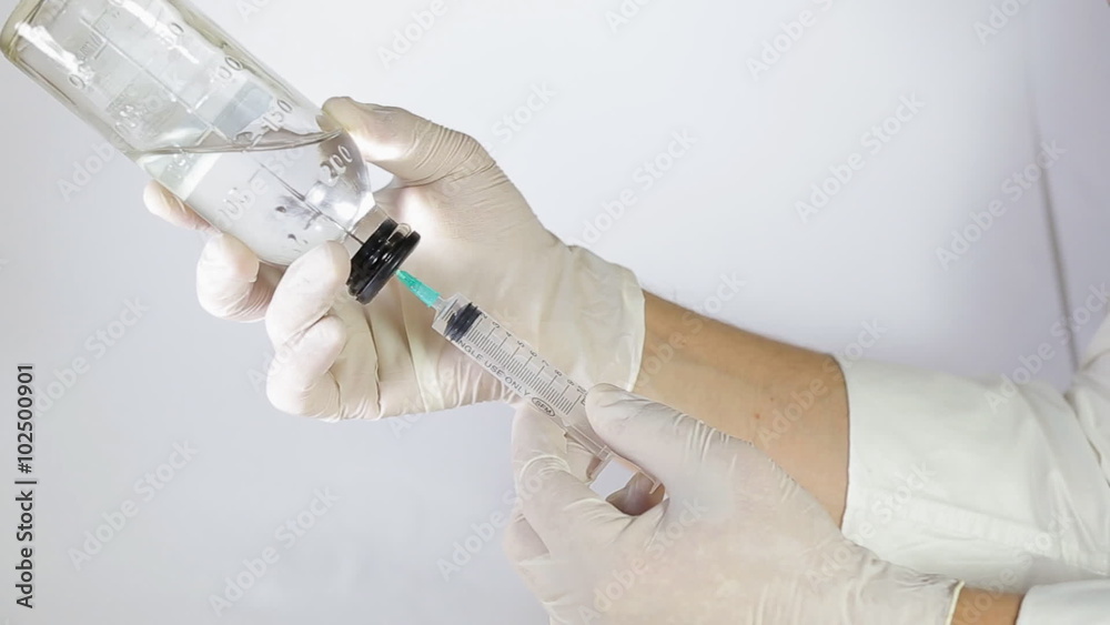 Syringe, medical injection in hand