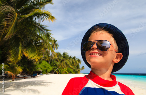happy boy on tropical beach vacation