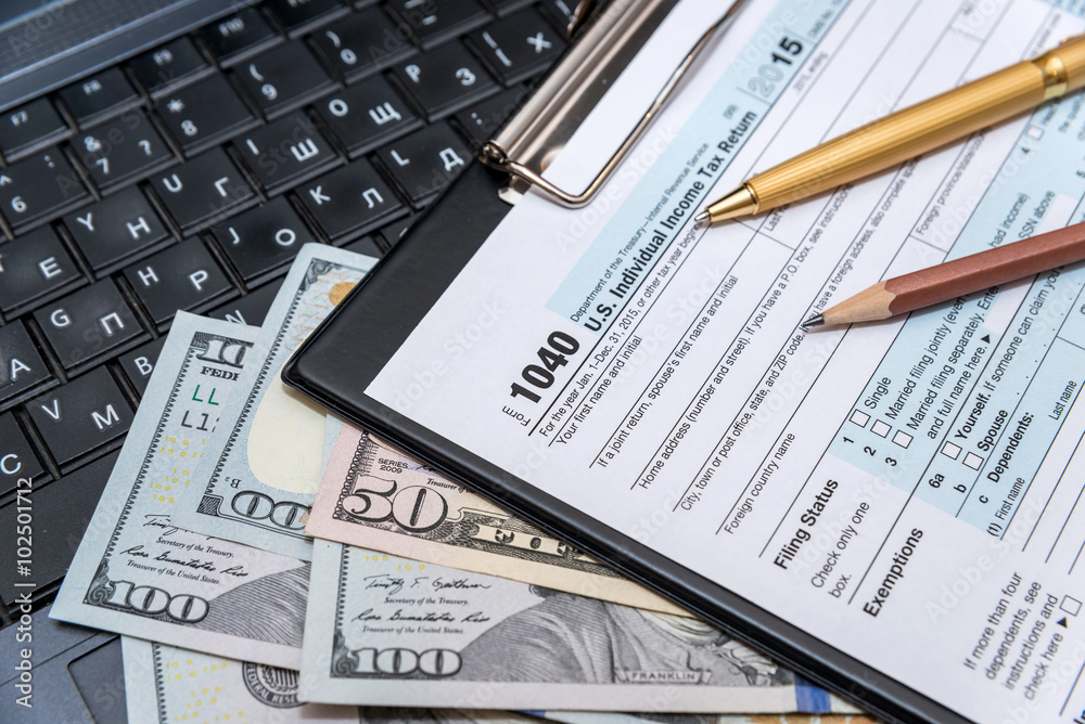 Obraz premium tax form 1040 with laptop