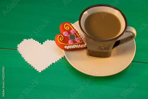 A cup of coffee with gingerbread