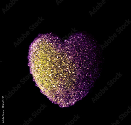 holiday decoration in shape of heart against black background