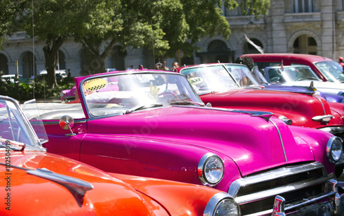 Taxis are waiting for the tourists in the center of Havana © akturer
