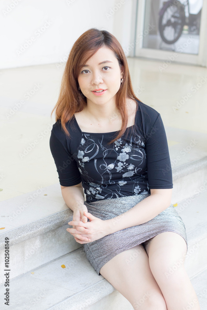 Fototapeta premium Portrait of thai adult businesswoman beautiful girl relax and smile