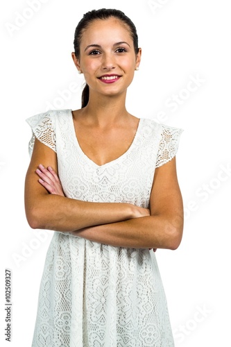 Portrait of smiling woman with arms crossed photo