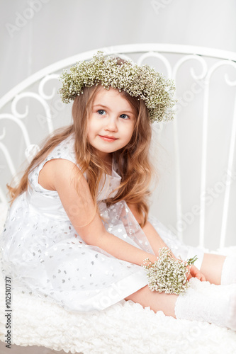 Cute little girl with a wreath photo