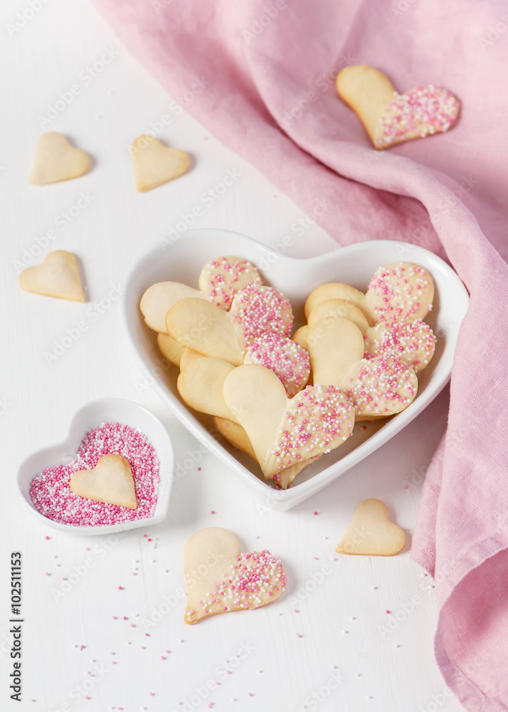Homemade heart shaped cookies with white chocolate and pink sugar sprinkles. Valentines day. Homemade heart shaped cookies with white chocolate and pink sugar sprinkles. Valentines day.