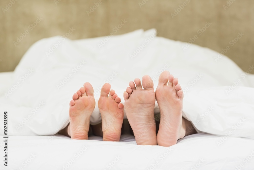 Close up of couples feet Close up of couples feet