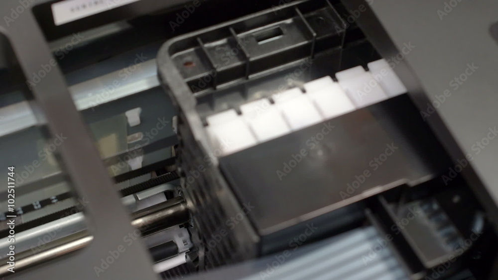 Inkjet printer head in action, close up view Inkjet printer head in action, close up view