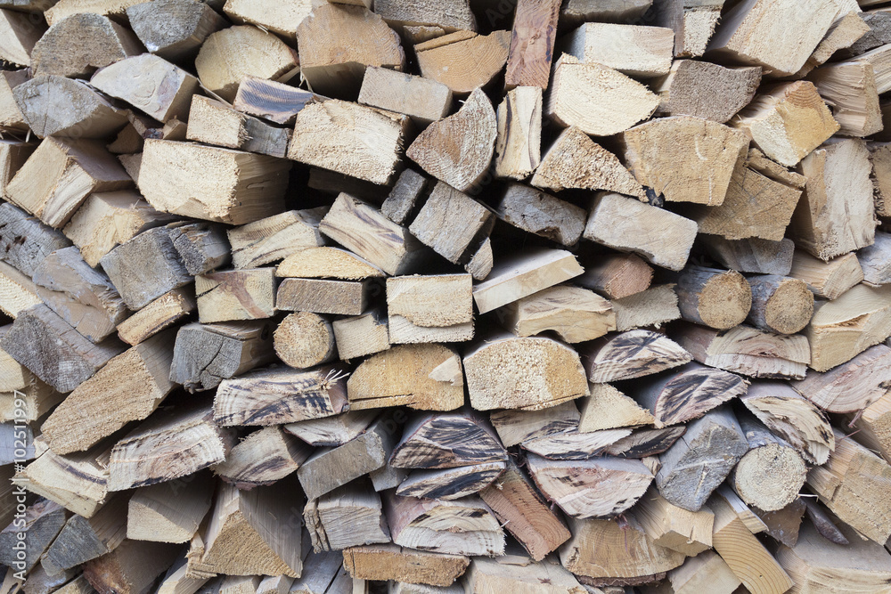 Chopped firewood, stacked and ready for winter. Chopped firewood, stacked and ready for winter.