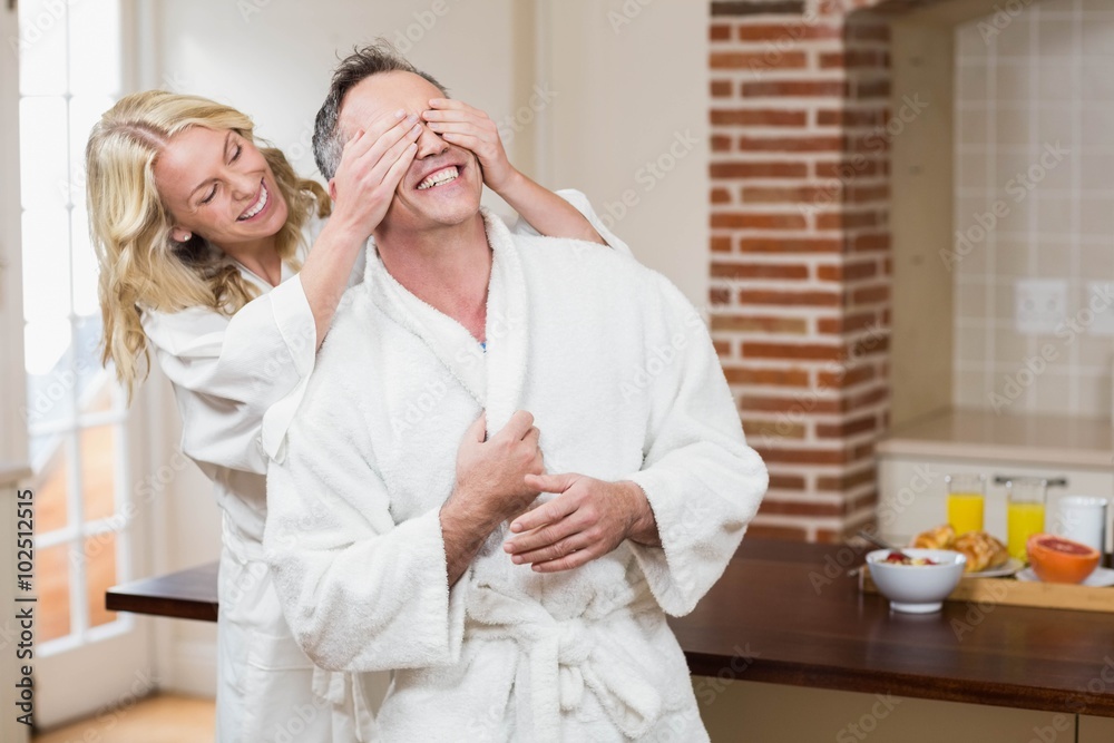 Woman covering her husband eyes Woman covering her husband eyes
