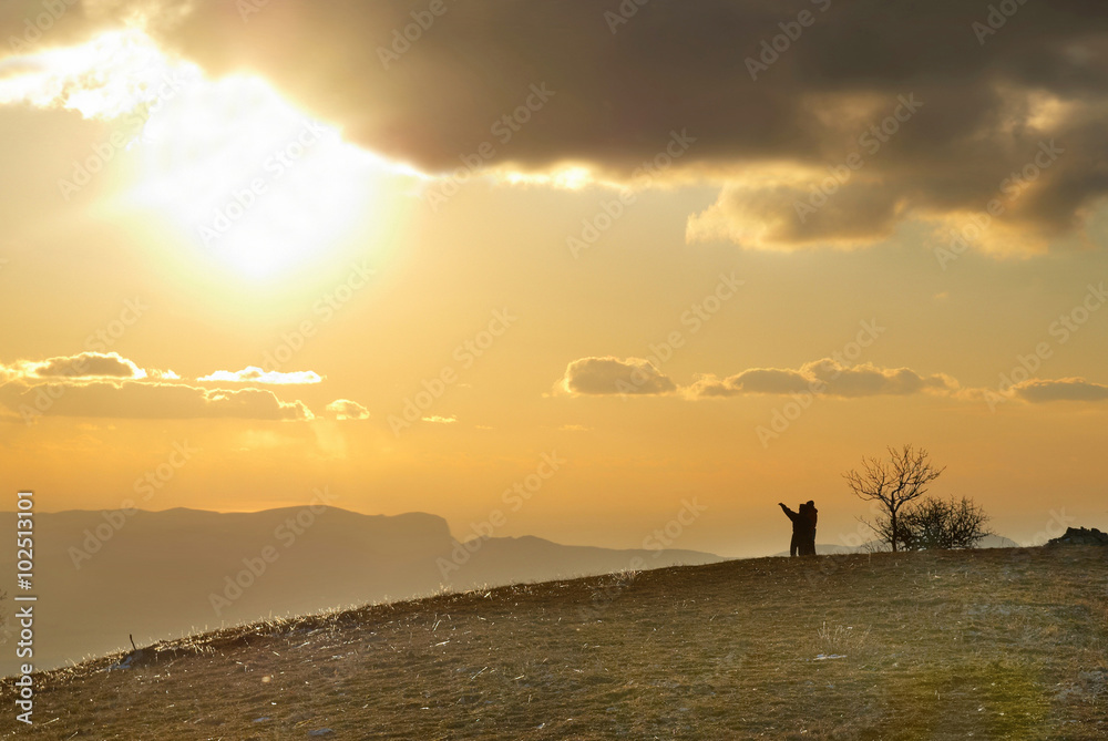 Couple on the hill.