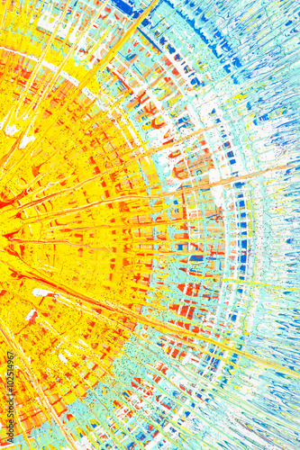 Foto Turquoise, yellow and red  paint splashes on the cardboard .