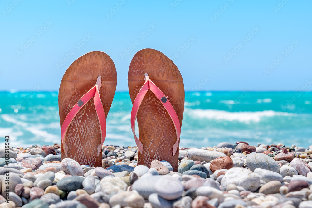 Sandals on the beach Photos | Adobe Stock