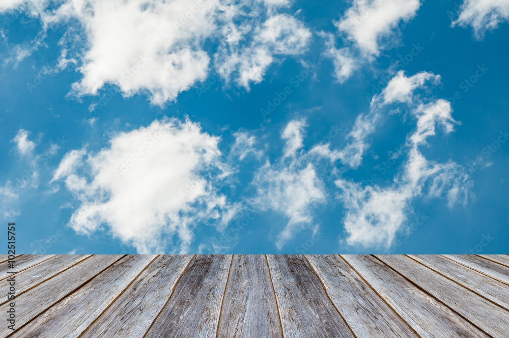 Blue sky and cloud on wood  background