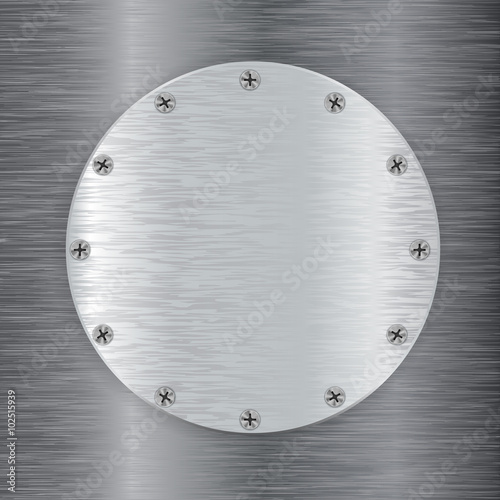 Metal round plate with screw head.