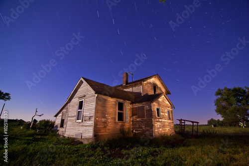 abandoned farmhouse at night