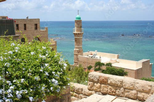 views of the Mediterranean in Jaffa, Tel Aviv, Israel. Ottoman era stone buildings, including a mosque and the Mediterranean sea in Israel photo