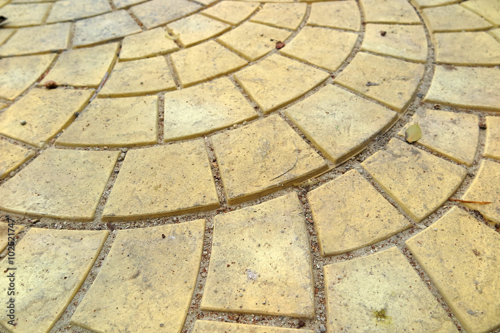 Modern yellow paving slabs laid out spherically Modern yellow paving slabs laid out spherically