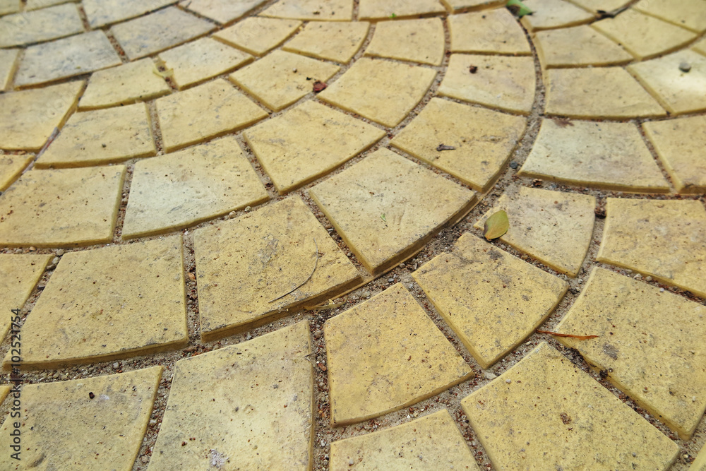 Modern yellow paving slabs laid out spherically Modern yellow paving slabs laid out spherically
