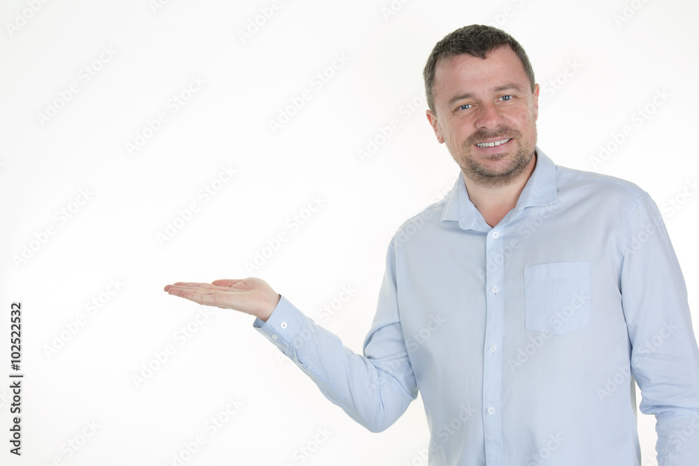 Smiling man presenting and showing your text or product isolated Smiling man presenting and showing your text or product isolated