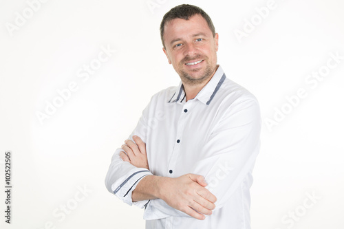 Confident business leader or manager standing with his arms folded