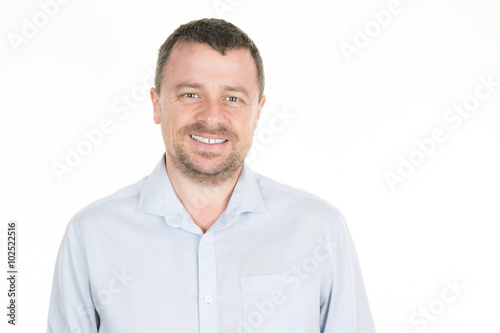 Closeup of happy smiling guy looking at camera isolated on white background © OceanProd