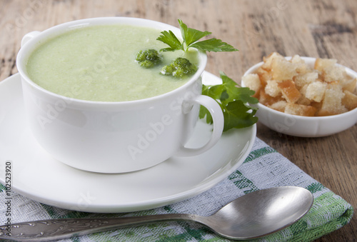 Cream of broccoli with croutons and parsley