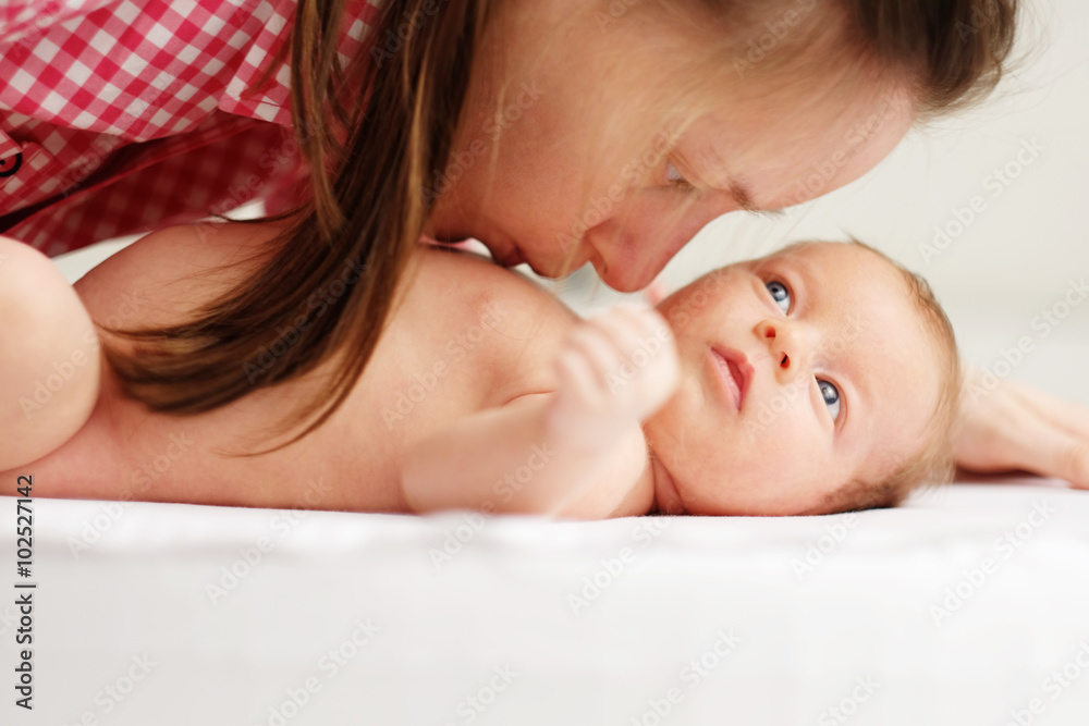 One month old newborn baby with mother One month old newborn baby with mother