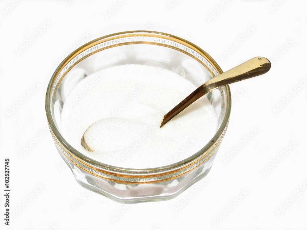 Bowl of sugar and spoon on white background Bowl of sugar and spoon on white background