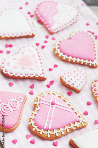 Pastel colored sugar cookies for valentines day on white plate