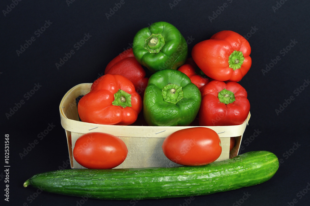 A pepper assortment with tomato and cucumber. A pepper assortment with tomato and cucumber.