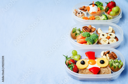 school lunch box for kids with food in the form of funny faces