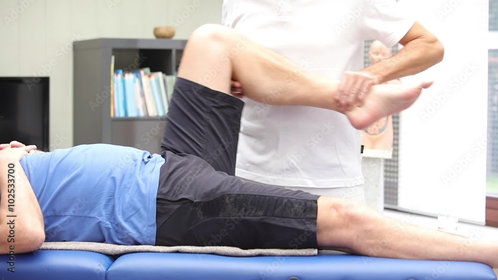 Doctor or physiotherapist performing hip mobility examination Doctor or physiotherapist performing hip mobility examination