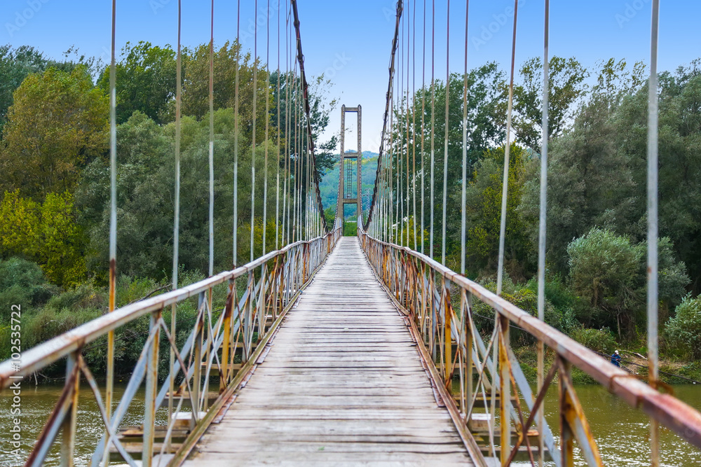Obraz premium Old wooden suspension bridge