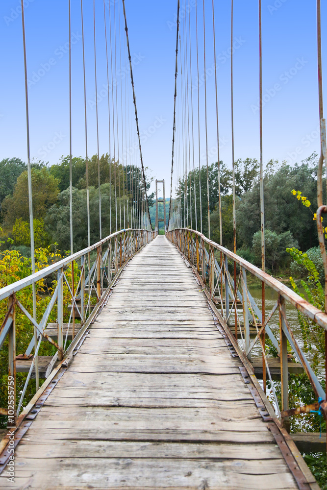 Obraz premium Old wooden suspension bridge